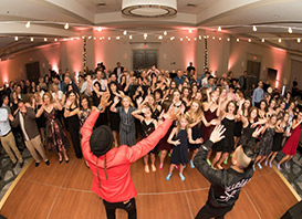 Denver Wedding DJ Service - A group of people dancing on a dance floor at an event.